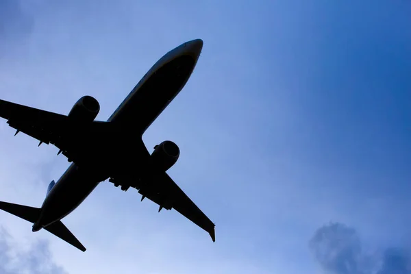 stock image Plane flying approaching airport with clear sky in Alicante