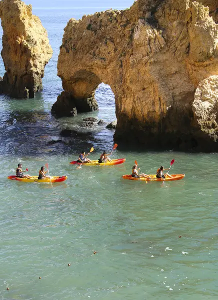 stock image Lagos, Algarve, Portugal- October 20, 2022: People canoeing and visiting limestone formations and natural features in Ponta da Piedade