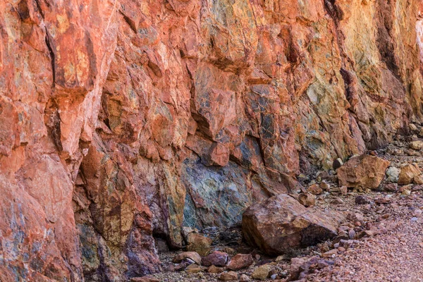 Colorful volcanic rock textures and minerals of a mountain in Rodalquilar, Almeria, Spain. Ignimbrite with Jarosite and Goethite