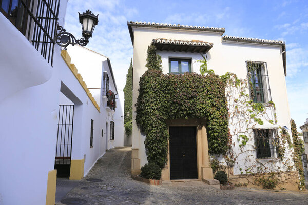 Narrow cobblestone streets and whitewashed facades of Ronda city, Malaga, Spain