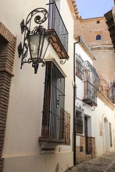 Narrow cobblestone streets and facades of Ronda city, Malaga, Spain