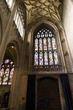 Bristol, England- March 29, 2024: Colorful stained glass window in St. Mary Redcliffe church clipart