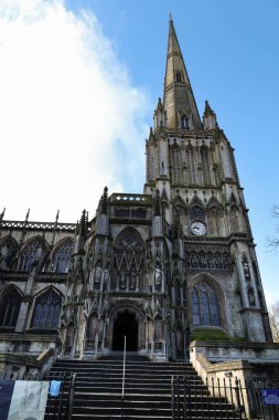 Bristol, England- March 29, 2024: Colossal facade of St. Mary Redcliffe Church in Bristol in the morning clipart