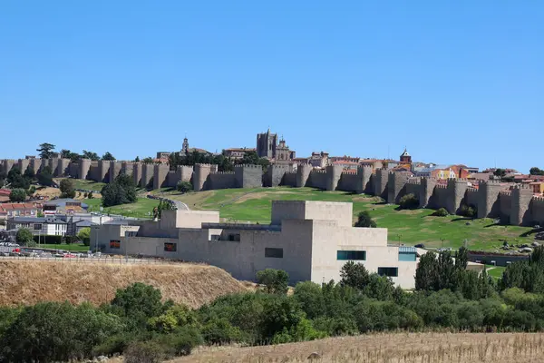 stock image Avila, Castilla y Leon, Spain- August 17, 2024: Panoramic view of Avila walls and fortress on a sunny day