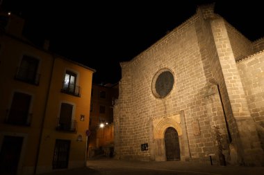 Avila, Castilla y Leon, Spain- August 17, 2024: Illuminated San Juan Bautista church clipart