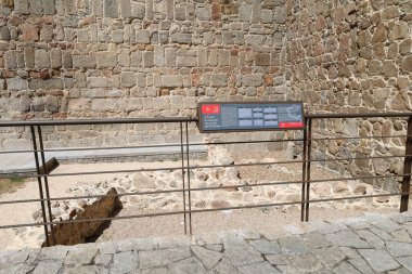 Avila, Castilla y Leon, Spain- August 17, 2024: Roman remains at The majestic walls of Avila city, Spain clipart