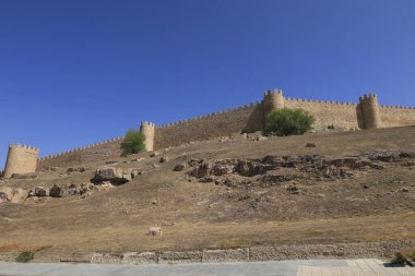 The majestic walls in the old town of Avila city, Spain clipart