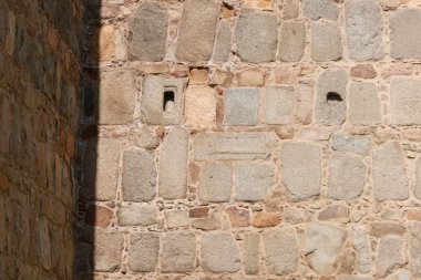 Funerary steles, cupas, cists and other roman remains used to built The majestic walls of Avila city, Spain clipart