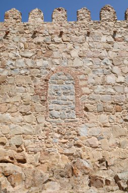 Closed door on the walls of the Palace of Los Davila in the old town of Avila city clipart