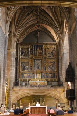 Avila, Castilla y Leon, Spain- August 18, 2024: Interior and altarpiece of The Royal Monastery of St. Thomas in Avila city clipart