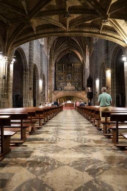 Avila, Castilla y Leon, Spain- August 18, 2024: Interior and altarpiece of The Royal Monastery of St. Thomas in Avila city clipart