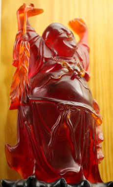 Beautiful Budai Hesheng figure made of amber clipart