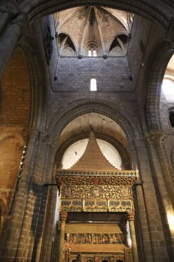 Avila, Castilla y Leon, Spain- August 18, 2024: Cenotaph in the Basilica of San Vicente Church, also known as church of the martyrs brothers Saint Vincent, Sabina and Cristeta, in the old town of Avila city clipart