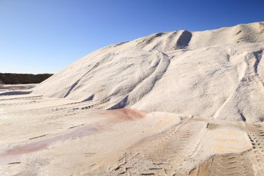 Mountain of salt in the Saltworks of the natural park of Santa Pola town, Alicante, Spain clipart