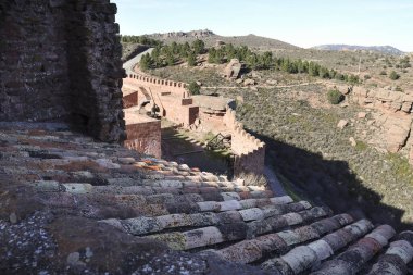 Peracense, Teruel, Spain- January 6, 2025: The Castle of Peracense on rodeno stone mountain in Teruel province, Aragon, Spain clipart