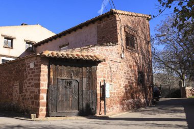 Rodenas, Teruel, Spain- January 5, 2025: Red rodeno stone houses in Rodenas town, Teruel, Spain