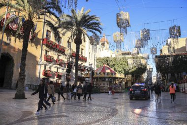 Elche, Alicante, Spain- December 28, 2024: Police car guarding the Christmas Market in the town hall square of Elche clipart