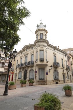 Novelda, Alicante, Spain- September 26, 2025: Old and majestic antique Red Cross headquarters facade in Novelda, Alicante on a cloudy day of summer