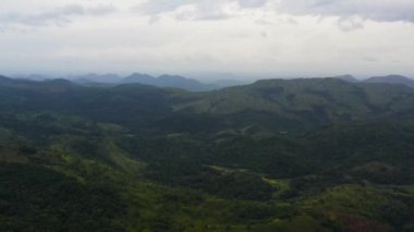 Top view of Mountain slopes with rainforest and agricultural land of farmers. Sri Lanka.