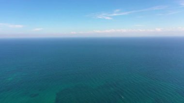 Aerial view of Blue sea and sky with clouds.