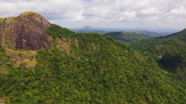 Aerial view of Mountains with rainforest and jungle in the mountainous province of Sri Lanka.
