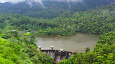 Top view of Water dam and reservoir lake, generating hydro electricity power renewable energy. Sri Lanka.