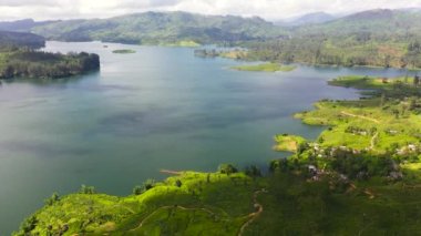 Tea plantation and Maskeliya Lake. Maussakelle reservior, Sri Lanka.