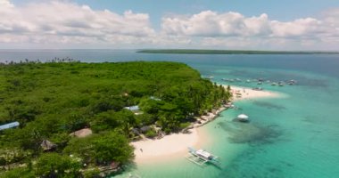 Aerial view of Tropical beach with palm trees. Virgin Island, Philippines.