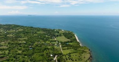 Coastline of Negros island and blue sea. Seascape: Ocean and blue sky. Philippines.
