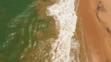 Aerial view of Seascape with tropical sandy beach and blue ocean. Lankavatara, Sri Lanka.