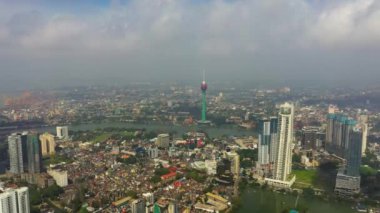 Aerial drone of Colombo city skyline with modern architecture buildings and lotus towers.