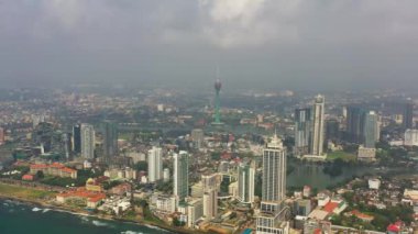 Aerial view of Colombo city skyline with modern architecture buildings and lotus towers.