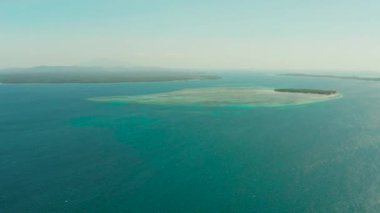 Tropical islands among atolls and coral reefs., aerial drone. Summer and travel vacation concept.