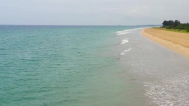 Sandy beach and turquoise water. Nilaveli Beach, Sri Lanka, Trincomalee. Summer and travel vacation concept.
