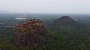 Top view of Sigiriya rock and Pidurangala rock among the dense forest on the island of Sri Lanka. Tropical green forest and jungle.