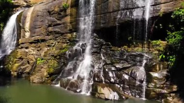 Aerial view of Sera ella Falls in green forest. Waterfall in the tropical mountain jungle. Sri Lanka.