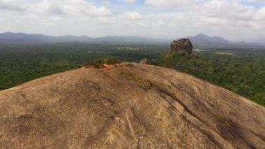 Aerial drone of Sigiriya Rock with a fortress and Pidurangala rock is a famous tourist place in Sri Lanka.