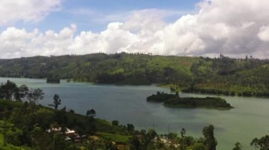 A lake among the hills with tea plantations in the mountains. Maskeliya, Castlereigh, Sri Lanka.