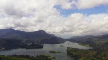 Aerial view of lake in a mountainous area among tea plantations. Maskeliya, Castlereigh, Sri Lanka.