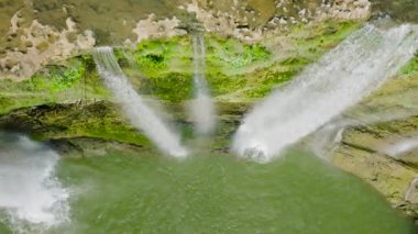 A tropical Niludhan waterfall in the jungles. Slow motion. Negros, Philippines.