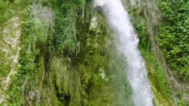 Beautiful waterfall in slow motion. Inambakan Falls in the tropical mountain jungle. Cebu, Philippines.