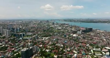 Aerial view of Cebu city with port, modern buildings and business districts. Philippines.