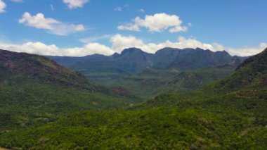 Mountain landscape with mountain peaks covered with forest. Slopes of mountains with evergreen vegetation.Sri Lanka.