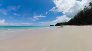 Wide sandy beach with sea waves. Borneo, Malaysia. Kalampunian Beach.