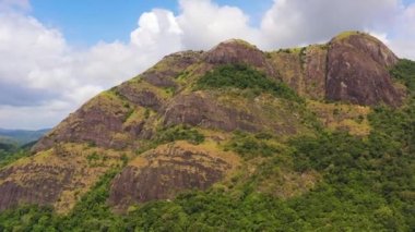 Aerial view of Mountain slopes covered with rainforest and jungle View from above. Sri Lanka.