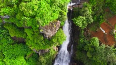 Waterfall among tea plantations. Ramboda Falls, Sri Lanka.