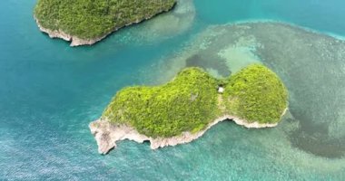 Aerial drone of islands in a beautiful bay in the tropics. Sipalay, Negros, Philippines.