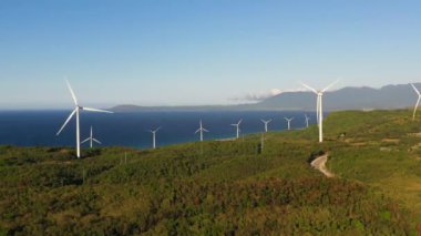 Aerial drone of Wind turbines on the coastline. Wind power plant. Philippines.Wind turbines on the coastline. Wind power plant. Philippines.