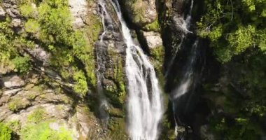 Waterfall in a tropical forest. Balea Falls in the jungle. Negros, Philippines.