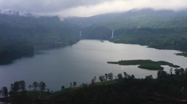 Aerial view of Lake in the mountains among the tea plantations. Maskeliya, Maussakelle reservior, Sri Lanka.